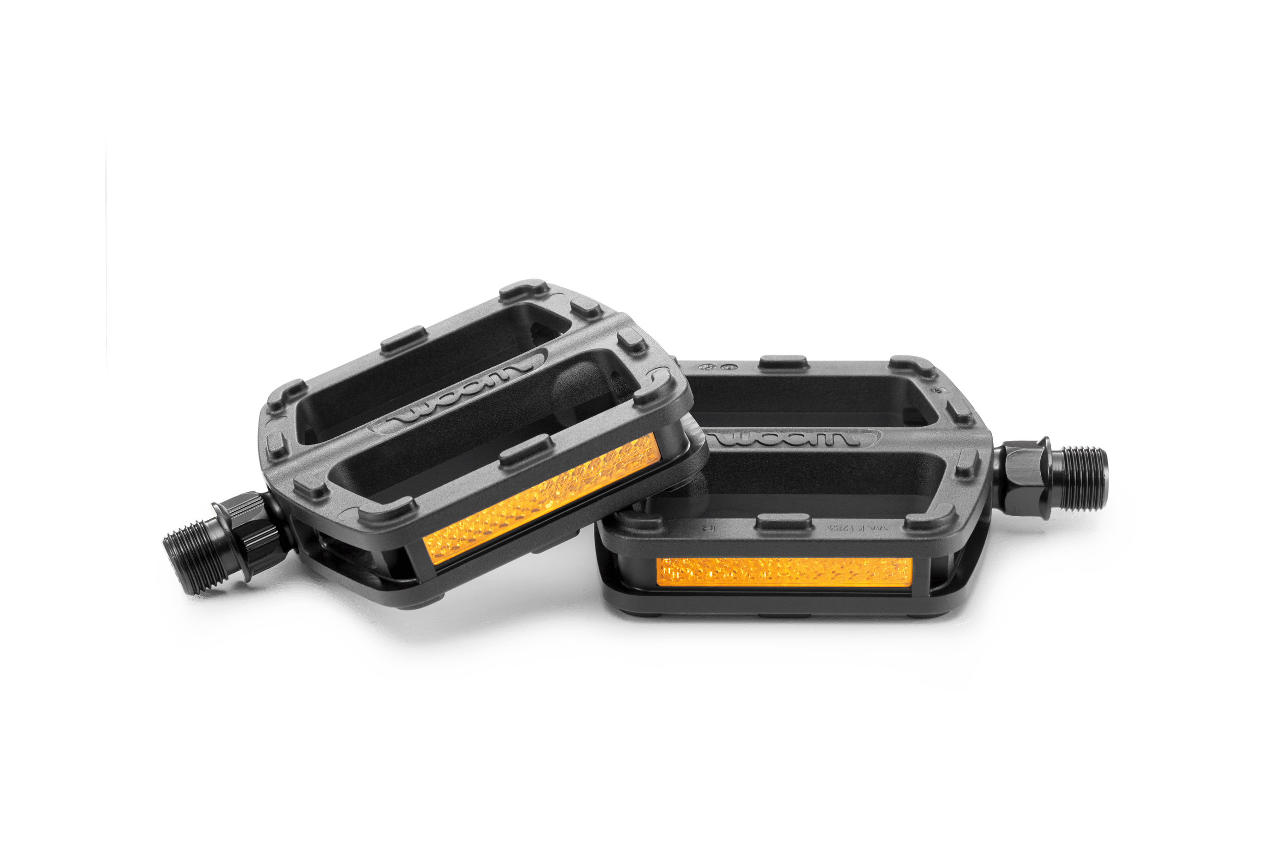Two black bike pedals with orange reflectors