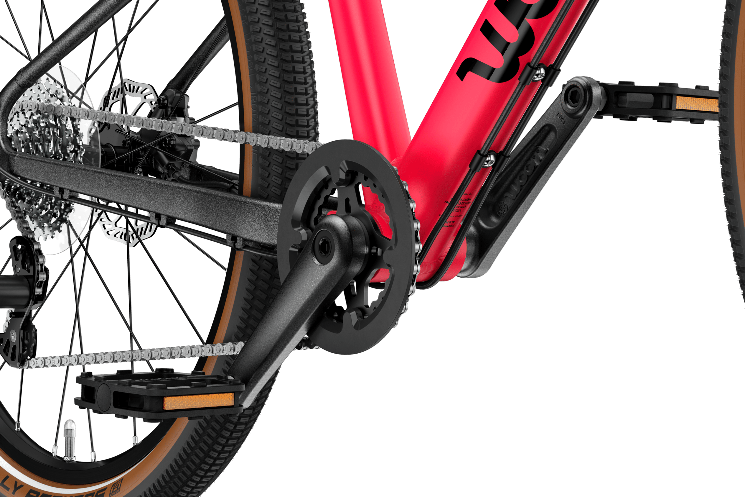 Detailed view of the cranks and pedals on the woom EXPLORE 4 children's bike.