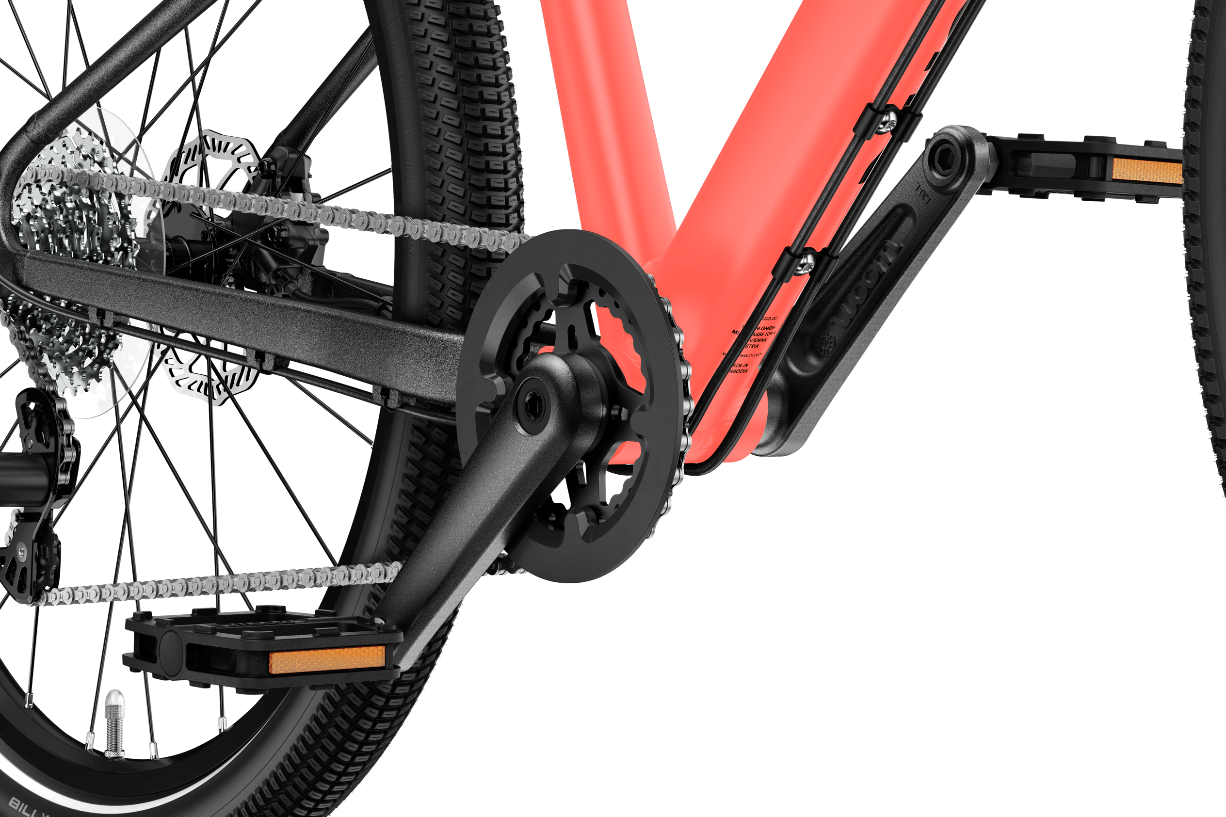Detaljerad vy av vevparti och pedaler på woom EXPLORE 5-barncykeln.