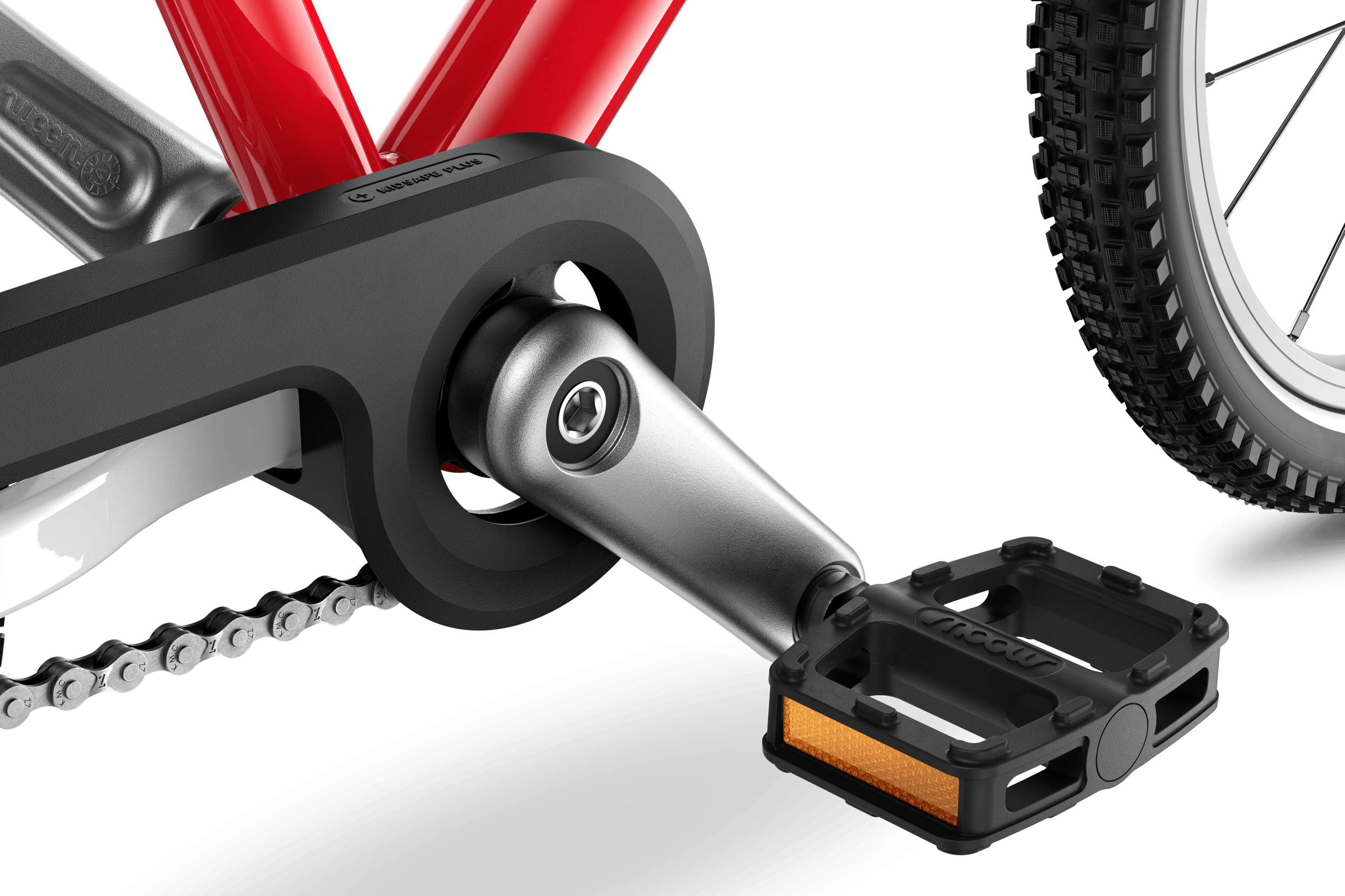 Detailed view of the cranks, pedals and chainguard on the woom GO 3 children's bike