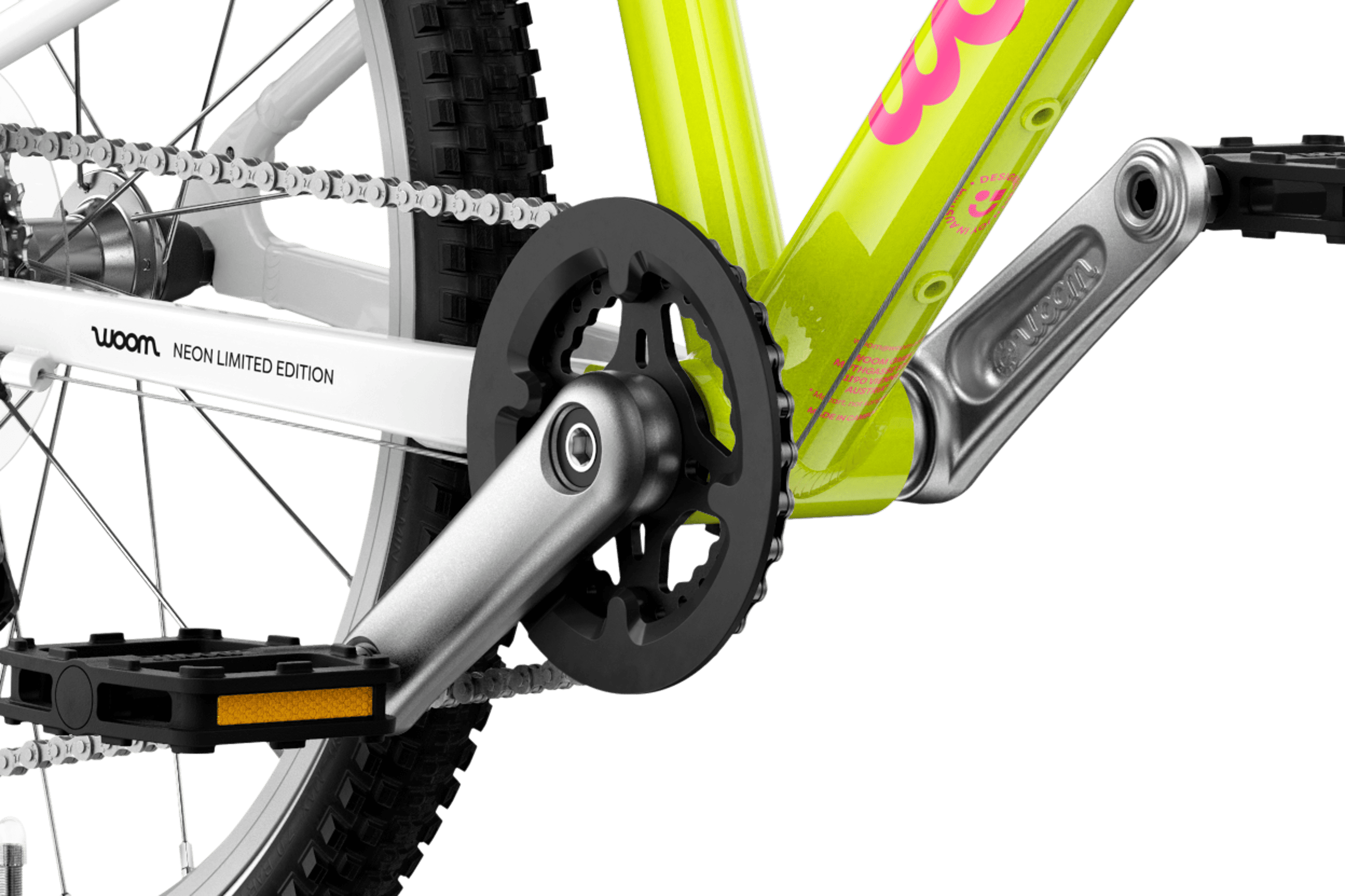 Detailed view of the cranks and pedals on the woom GO 4 children's bike