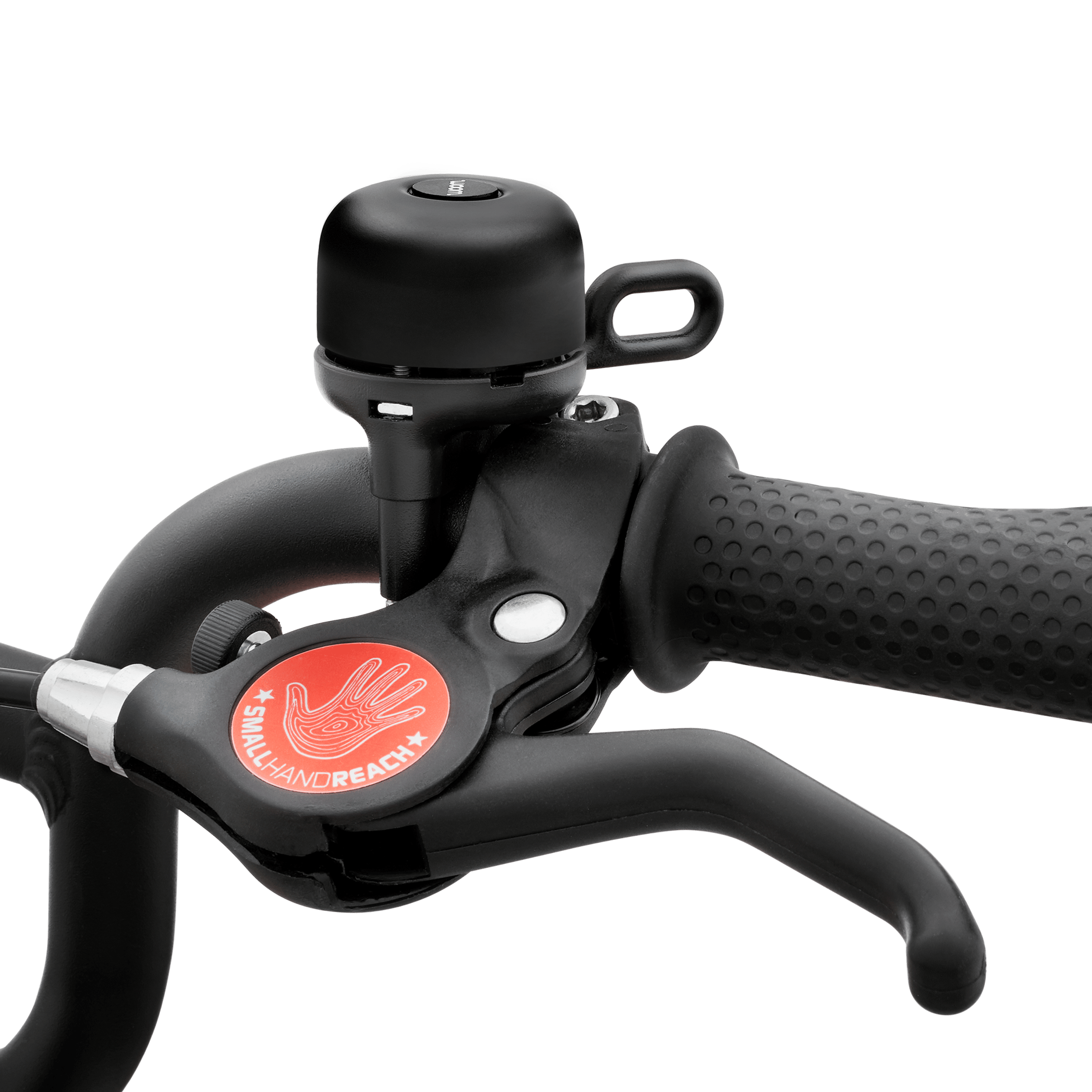 Black BING bicycle bell mounted on the handlebars of a woom bike.