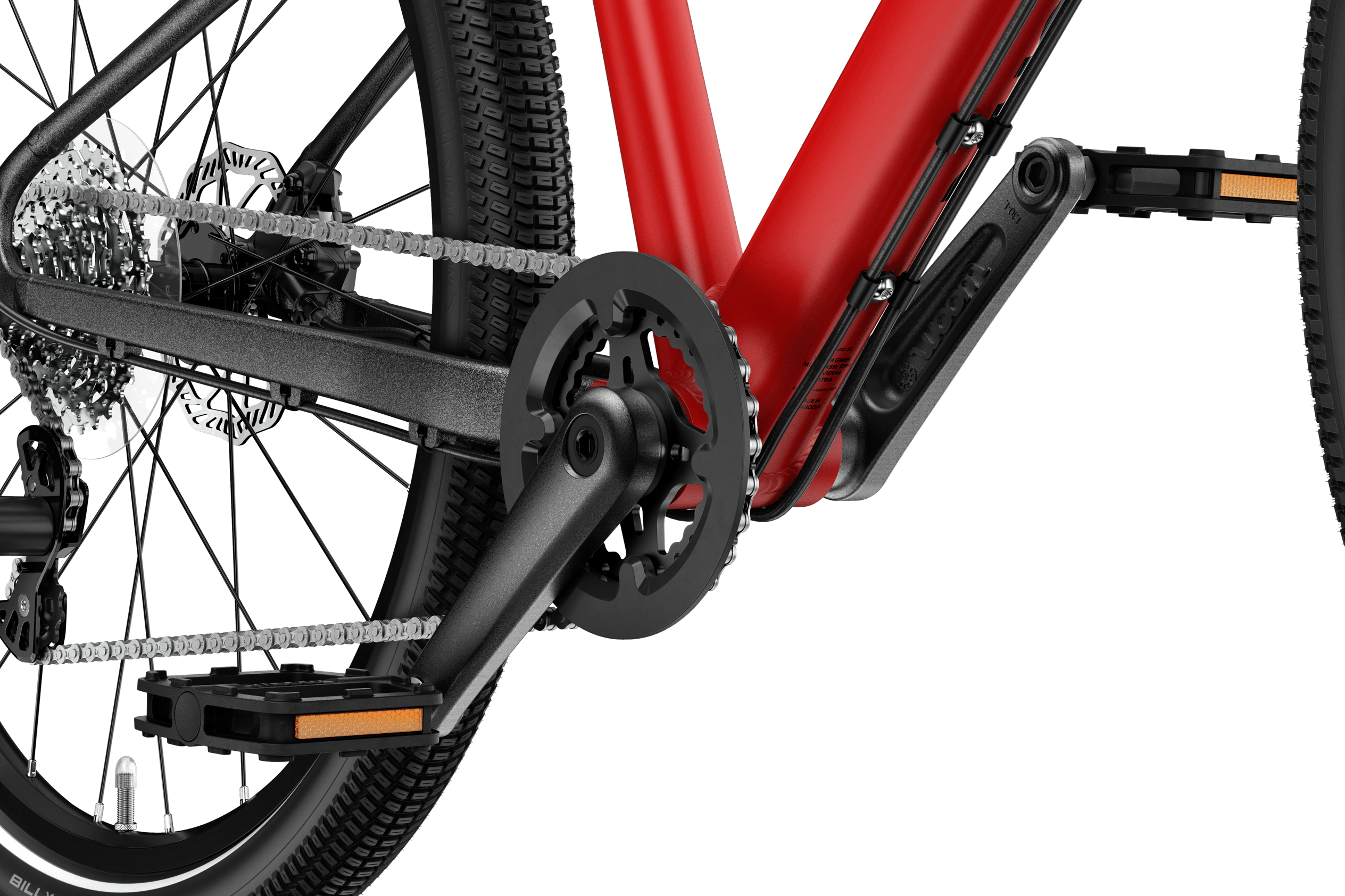 Detaljerad vy av vevparti och pedaler på woom EXPLORE 6-barncykeln.