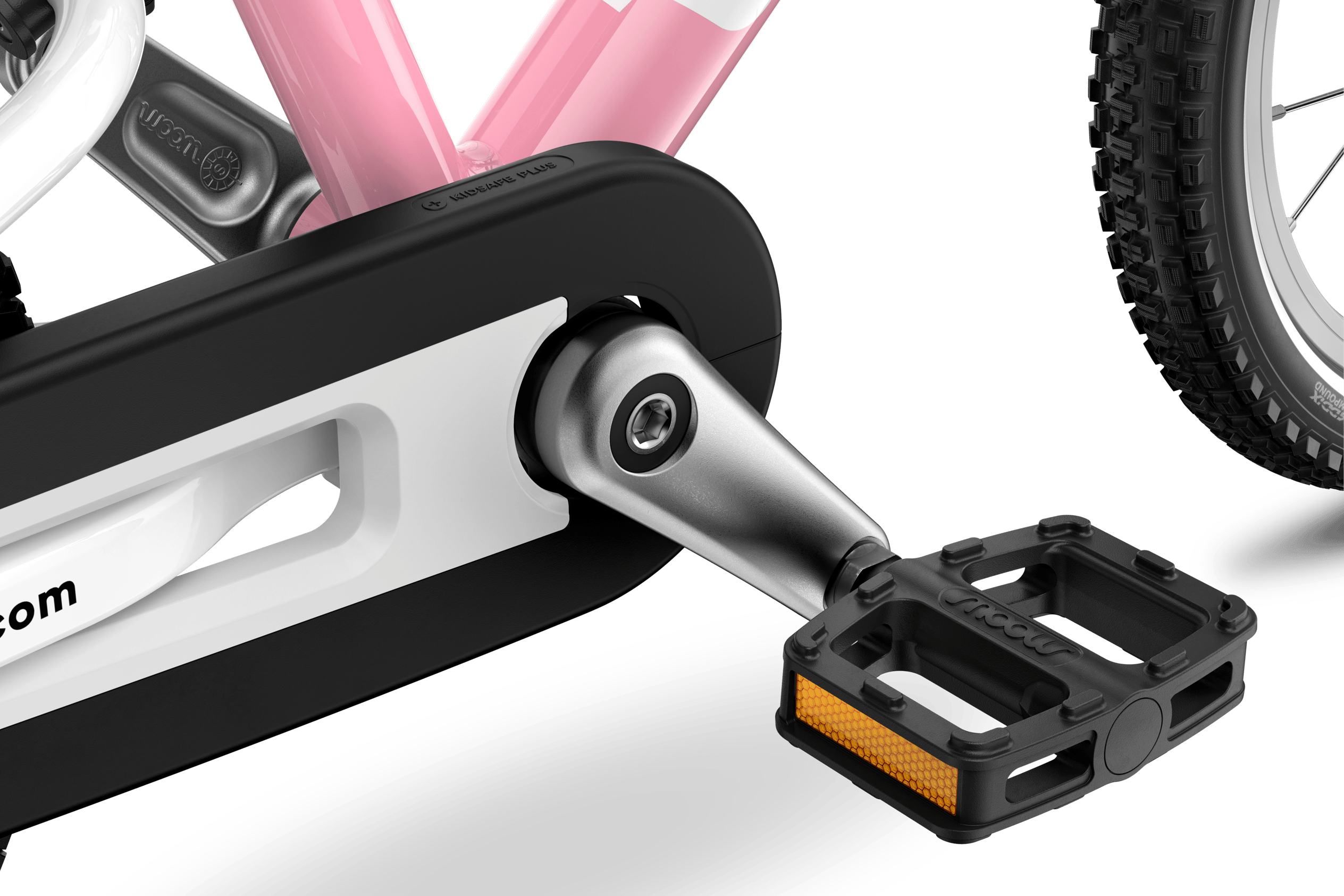 Detailed view of the pedals, cranks and chainguard on the woom GO 2 children's bike