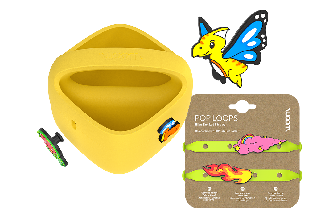Purple woom POP Kids' Bike Basket with POP ONS plus neon-green POP LOOPS on card and a new flying dino charm