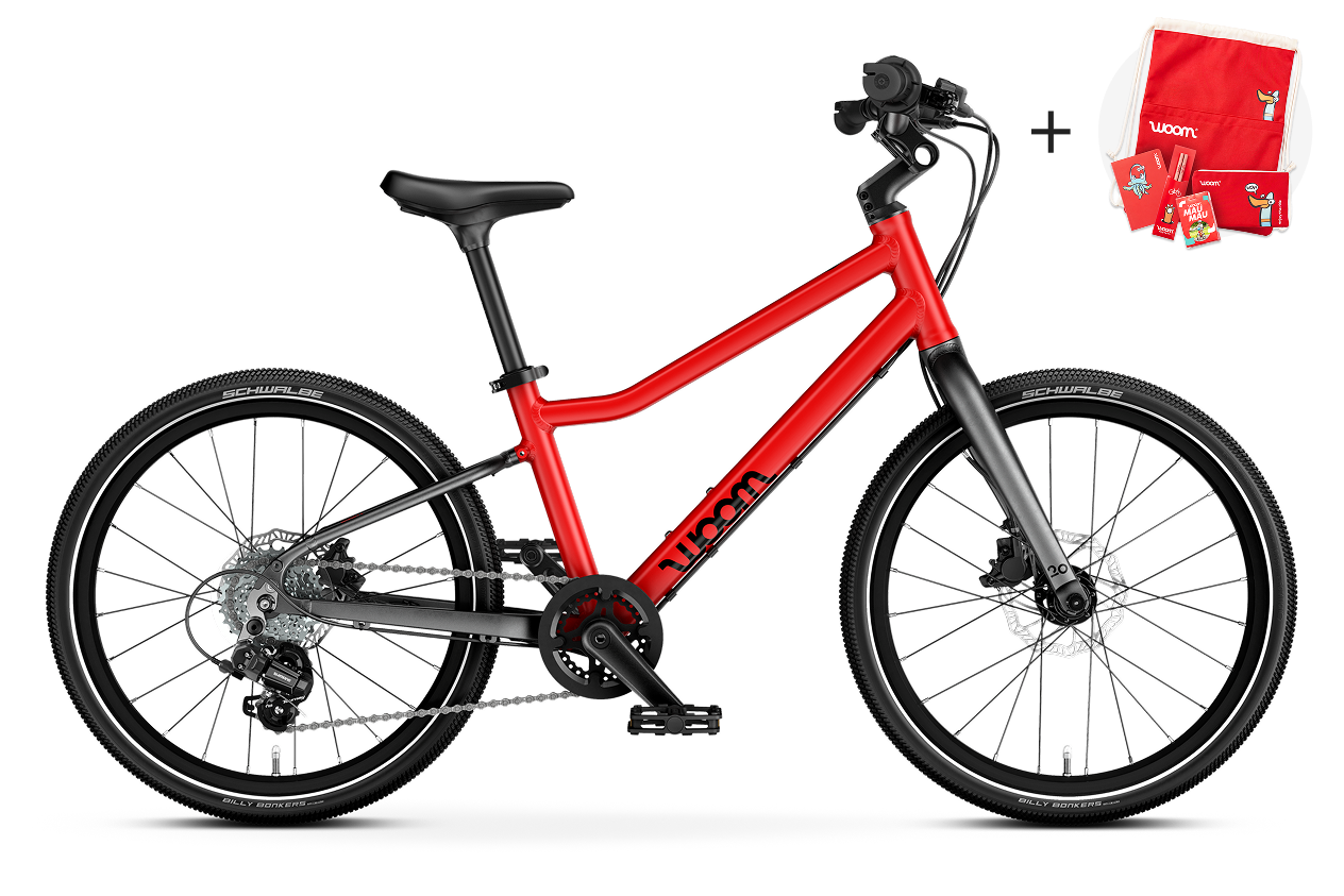 Vue latérale du vélo enfant woom EXPLORE 4, sens de la marche à droite.