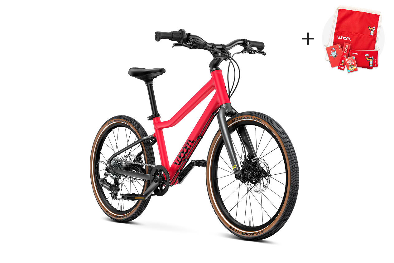 Vue latérale du vélo enfant woom EXPLORE 4, sens de la marche à droite.