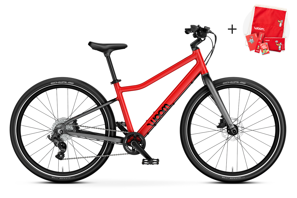 Vue latérale du vélo enfant woom EXPLORE 5, sens de la marche à droite.