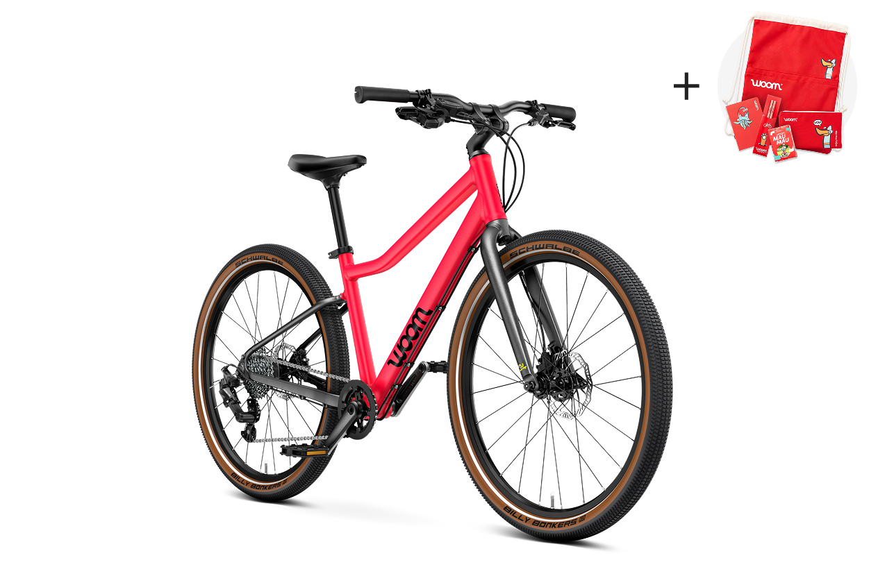 Vue latérale du vélo enfant woom EXPLORE 5, sens de la marche à droite.