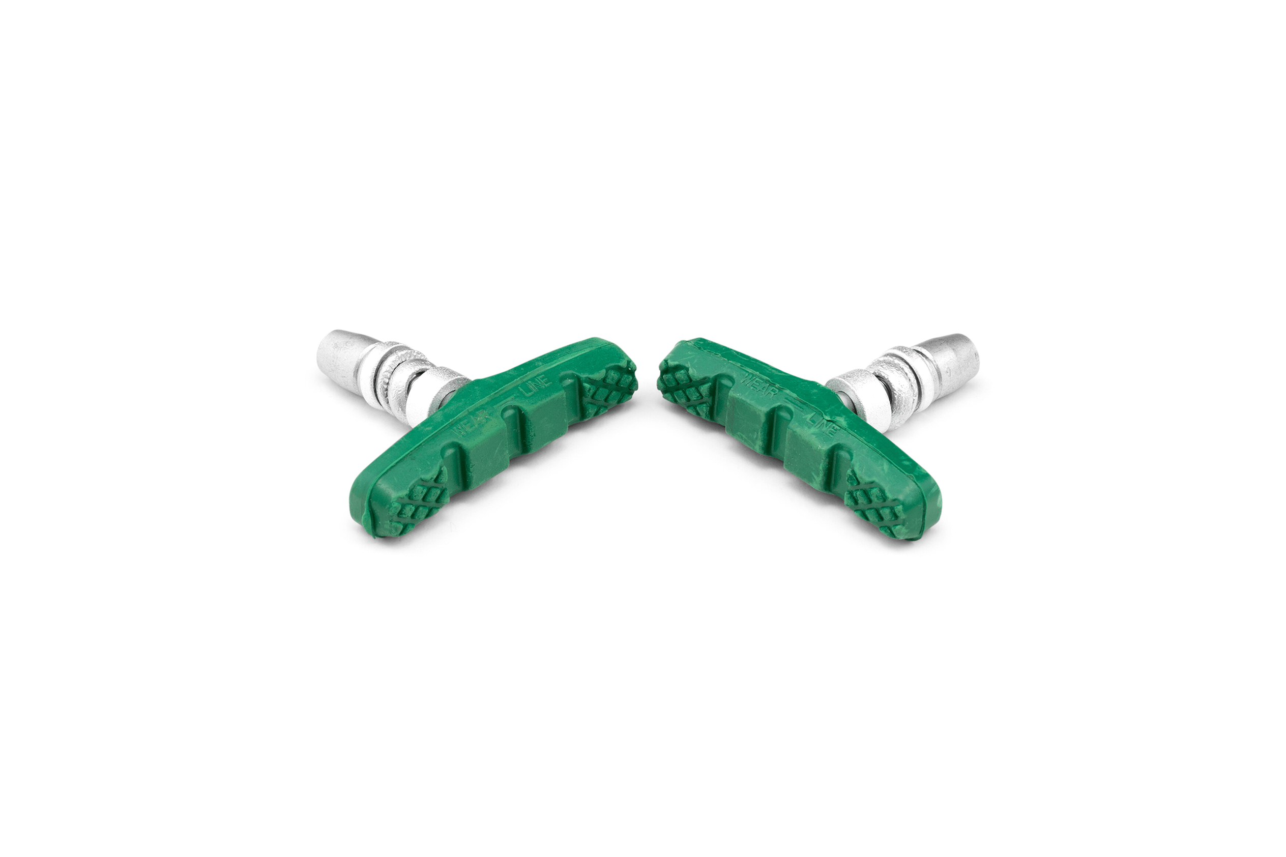 Två gröna bromsklossar med en svart bromsyta för woom ORIGINAL- och GO-cyklar.