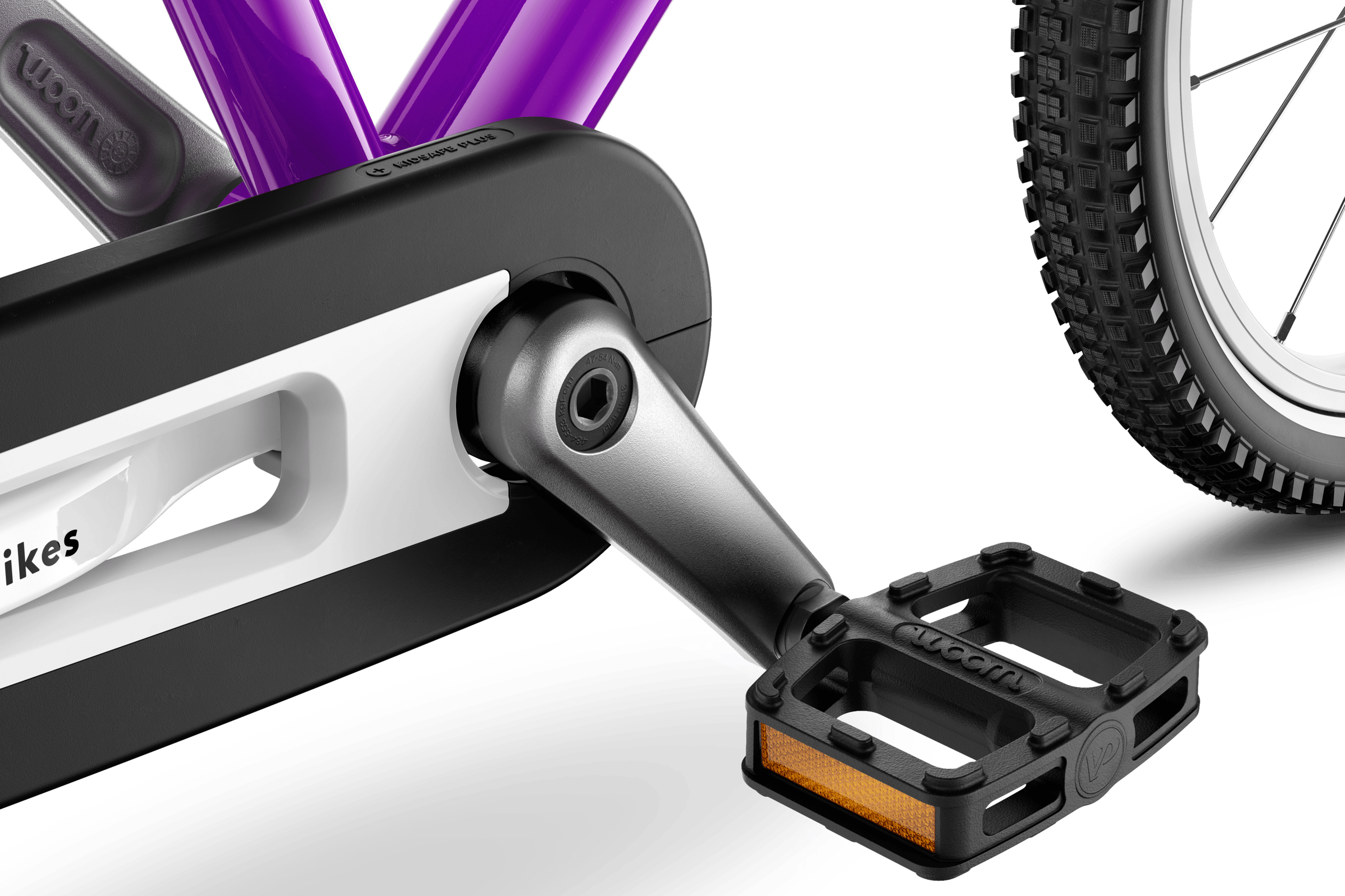 Detailed view of the pedals, cranks and chainguard on the woom ORIGINAL 2 children's bike.