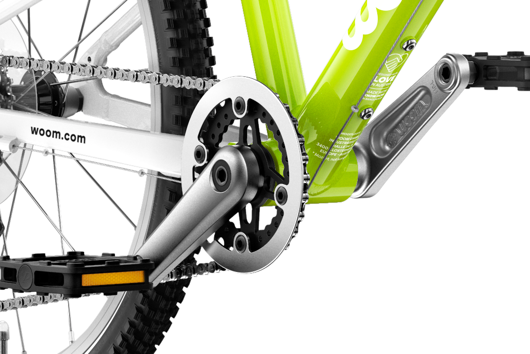 Detailed view of the cranks and pedals on the woom ORIGINAL 4 children's bike.