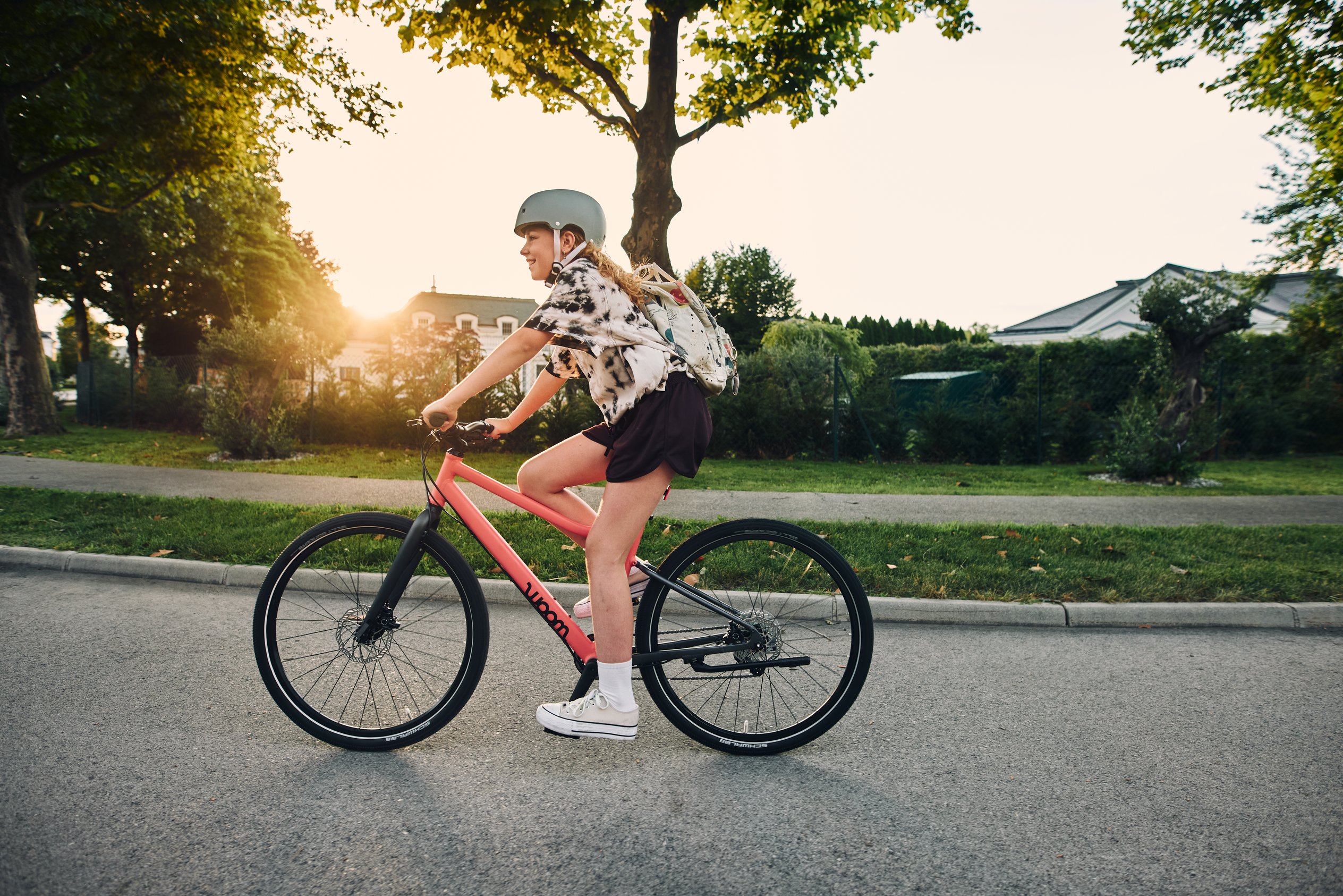 Detailed view of the back wheel on the woom EXPLORE 4 children's bike, including cassette and Shimano rear derailleur.