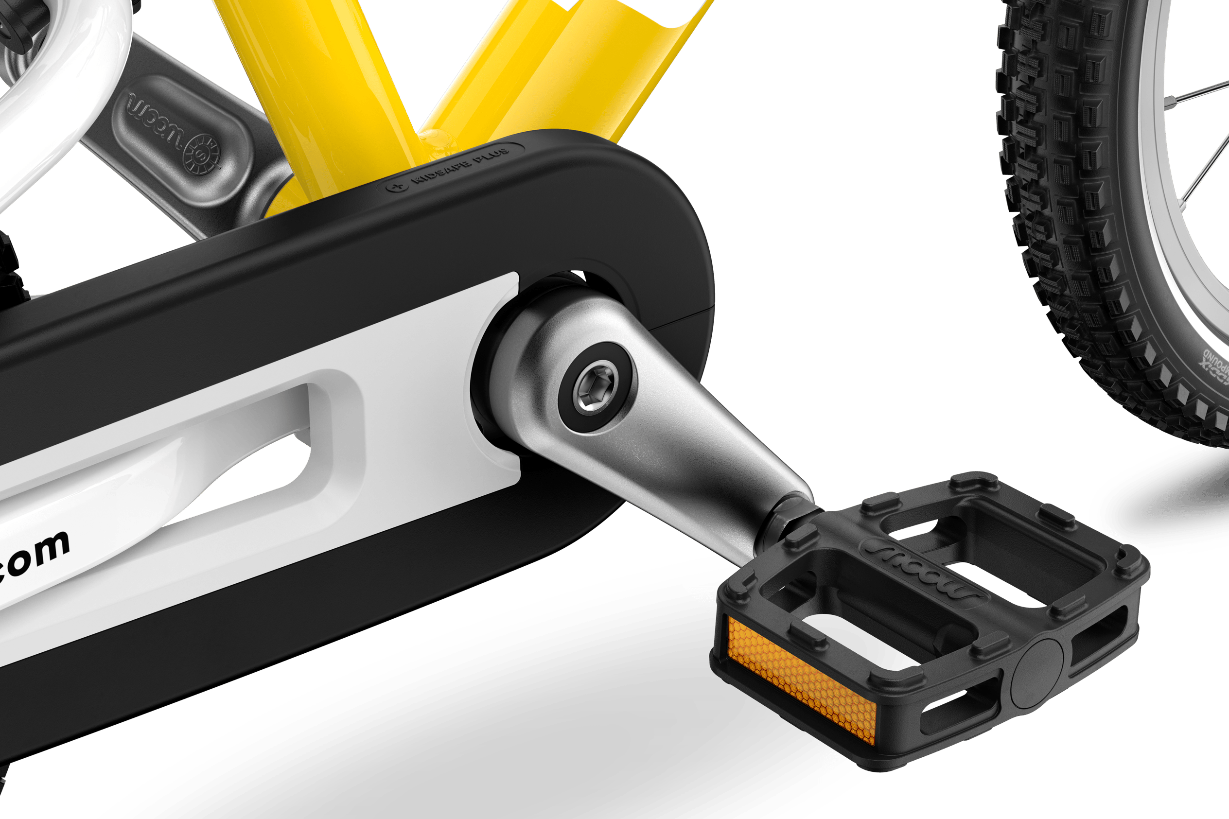 Detailed view of the pedals, cranks and chainguard on the woom GO 2 children's bike
